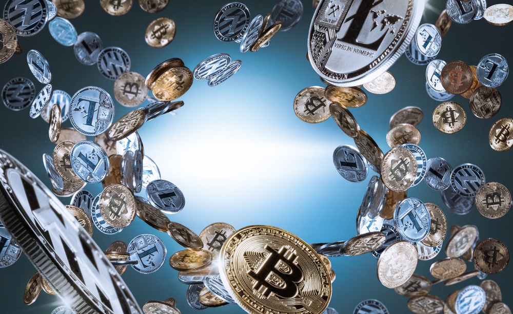 Flying and falling bitcoins and litecoins with free space in the middle.