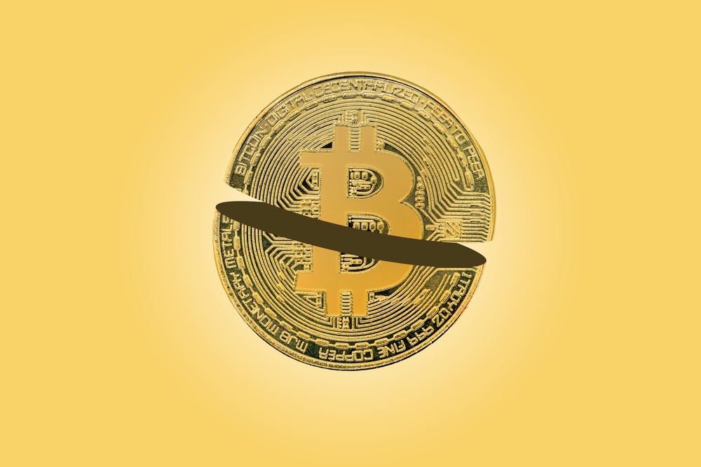 Bitcoin halving concept, block reward in half.